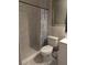 Bathroom with marbled tile in the shower and modern toilet at 1807 48Th W Ave, Bradenton, FL 34207
