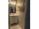 Bathroom featuring marble backsplash, a vanity with sink, and updated fixtures at 1807 48Th W Ave, Bradenton, FL 34207