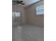 Bright bedroom featuring mirrored closet doors, a ceiling fan, and a window for natural light at 1807 48Th W Ave, Bradenton, FL 34207