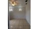Spacious bedroom with neutral walls, ceiling fan, and tile flooring at 1807 48Th W Ave, Bradenton, FL 34207