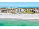 An aerial view of the condo complex showcasing beach access and manicured landscaping at 1945 Gulf Of Mexico Dr # M2-110, Longboat Key, FL 34228