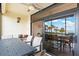 Relax on the screened balcony with ample seating and beautiful views at 1945 Gulf Of Mexico Dr # M2-110, Longboat Key, FL 34228