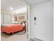 Bedroom features a queen size bed, closet and is viewed from the doorway entrance at 1945 Gulf Of Mexico Dr # M2-110, Longboat Key, FL 34228