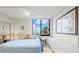Bright bedroom with ocean views and light colored flooring at 1945 Gulf Of Mexico Dr # M2-110, Longboat Key, FL 34228