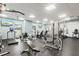 Community gym equipped with a variety of workout machines and TVs for entertainment at 1945 Gulf Of Mexico Dr # M2-110, Longboat Key, FL 34228