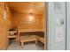 Inviting sauna with wooden benches, heater, and tiled floor, providing a relaxing experience at 1945 Gulf Of Mexico Dr # M2-110, Longboat Key, FL 34228