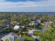 Aerial view of a charming two-story home and its surrounding tropical community near the water at 206 23Rd W St, Bradenton, FL 34205