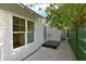 Back of the house is painted white with a black porch and white gravel at 206 23Rd W St, Bradenton, FL 34205