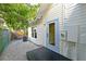 Back of the house is painted white with a black porch and white gravel at 206 23Rd W St, Bradenton, FL 34205