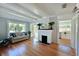Inviting living room featuring a decorative fireplace, hardwood floors and abundant natural light at 206 23Rd W St, Bradenton, FL 34205