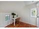 A bright home office space with white walls, wood floors and a window at 206 23Rd W St, Bradenton, FL 34205
