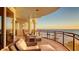 Spacious balcony with outdoor seating offering beautiful beach and ocean vistas at 2161 Gulf Of Mexico Dr # 6, Longboat Key, FL 34228