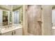 Luxurious bathroom featuring a marble shower and sink vanity at 2161 Gulf Of Mexico Dr # 6, Longboat Key, FL 34228