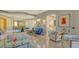 Elegant living room with high ceilings, lots of light, and views into the kitchen at 2161 Gulf Of Mexico Dr # 6, Longboat Key, FL 34228