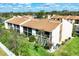 Aerial view of townhomes with well-maintained landscaping and parking at 2446 Clubhouse Cir # 202, Sarasota, FL 34232