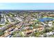 Panoramic aerial showcases the community's desirable location near a lake and golf course at 2446 Clubhouse Cir # 202, Sarasota, FL 34232
