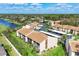 Aerial view of the condo community showcasing the buildings, landscaping, and parking areas at 2446 Clubhouse Cir # 202, Sarasota, FL 34232