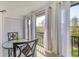 Relaxing balcony features seating for two and a large sliding glass doors for ample light at 2446 Clubhouse Cir # 202, Sarasota, FL 34232