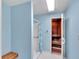 Bathroom featuring a shower with blue accents and a wooden sauna, creating a relaxing space at 2446 Clubhouse Cir # 202, Sarasota, FL 34232