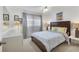 Comfortable bedroom with neutral tones, a large window with natural light, and a ceiling fan at 2446 Clubhouse Cir # 202, Sarasota, FL 34232