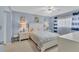 Inviting bedroom with a queen bed, soft blue walls, and coordinated decor at 2446 Clubhouse Cir # 202, Sarasota, FL 34232