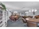 Inviting clubhouse with round tables and chairs, providing a comfortable space for gatherings and socializing at 2446 Clubhouse Cir # 202, Sarasota, FL 34232