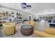 A spacious common area with ample seating, built-in bookshelves, and tasteful decor offers a comfortable social space at 2446 Clubhouse Cir # 202, Sarasota, FL 34232