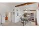 Cozy dining room with wooden beam accents, a ceiling fan, and a glass table perfect for entertaining at 2446 Clubhouse Cir # 202, Sarasota, FL 34232