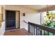 Welcoming entrance with decorative lighting and secure door at 2446 Clubhouse Cir # 202, Sarasota, FL 34232