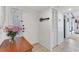 Entryway of home with tiled floor, console table and decorative art at 2446 Clubhouse Cir # 202, Sarasota, FL 34232