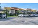Condo building with parking under carports and landscaping at 2446 Clubhouse Cir # 202, Sarasota, FL 34232