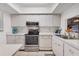 Clean kitchen with white appliances, ample cabinet space, and a window over the sink at 2446 Clubhouse Cir # 202, Sarasota, FL 34232