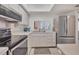 Efficient kitchen featuring white cabinetry and stainless steel appliances at 2446 Clubhouse Cir # 202, Sarasota, FL 34232