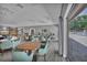 Open space with chairs, tables, and access to pool area at 2446 Clubhouse Cir # 202, Sarasota, FL 34232