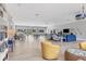 Large living area with wood look floors, sitting areas, and a TV at 2446 Clubhouse Cir # 202, Sarasota, FL 34232