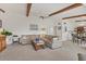 Comfortable living area with a ceiling fan, sofa, and a combined living and dining space at 2446 Clubhouse Cir # 202, Sarasota, FL 34232