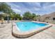 Community pool with shade trees and plenty of lounge chairs, offering a relaxing spot for residents in the community at 2446 Clubhouse Cir # 202, Sarasota, FL 34232