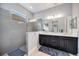 Modern bathroom with glass shower, double vanity sinks, and great lighting at 26800 Pavin Dr, Englewood, FL 34223