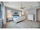 Comfortable bedroom with plenty of natural light and ceiling fan at 26800 Pavin Dr, Englewood, FL 34223