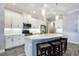 Well-equipped kitchen with stainless steel appliances, center island, and pendant lighting at 26800 Pavin Dr, Englewood, FL 34223