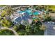 Aerial view of a stunning pool, surrounded by lush landscaping, with comfortable seating for relaxation at 26800 Pavin Dr, Englewood, FL 34223