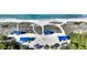 Overhead view of the beach with cabanas, providing a sunny and relaxing coastal atmosphere at 3151 Bayou Sound, Longboat Key, FL 34228