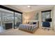 Bedroom with a screened lanai, striped bedding, TV and a dedicated workspace at 3151 Bayou Sound, Longboat Key, FL 34228