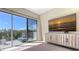 Bright bedroom with a large sliding glass door that leads to a private balcony with a lounger at 3151 Bayou Sound, Longboat Key, FL 34228