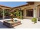 Picturesque courtyard with a tiered fountain, tiled flooring, and views of the property's elegant architecture at 3151 Bayou Sound, Longboat Key, FL 34228