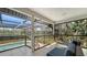 Screened lanai featuring a pool and comfortable lounge seating with private backyard views at 3151 Bayou Sound, Longboat Key, FL 34228