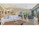 Spacious living room filled with natural light, featuring stylish furnishings and a comfortable seating area at 3151 Bayou Sound, Longboat Key, FL 34228