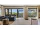 View from the living room of the screened lanai and the water, with native trees and plants at 3151 Bayou Sound, Longboat Key, FL 34228