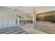 Bright primary bedroom features a large dresser with TV and a mirrored wall giving the room a spacious feel at 3151 Bayou Sound, Longboat Key, FL 34228