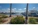 Picturesque view of a marina with various boats docked, tropical vegetation, and sunny skies at 3151 Bayou Sound, Longboat Key, FL 34228
